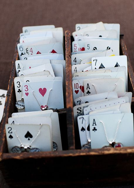 playing cards are arranged in a wooden box