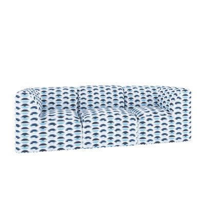 a blue and white patterned couch on a white background