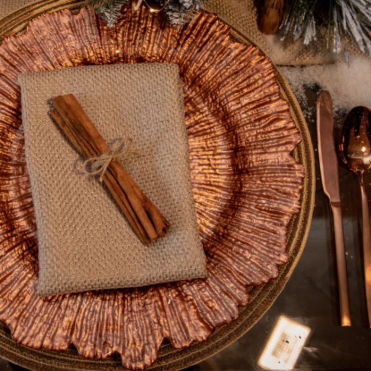 a place setting with silverware and napkins