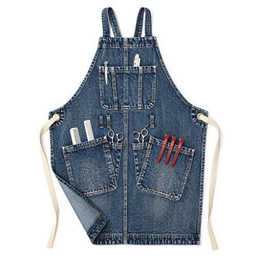 a denim apron with scissors and other tools in the pocket, on a white background