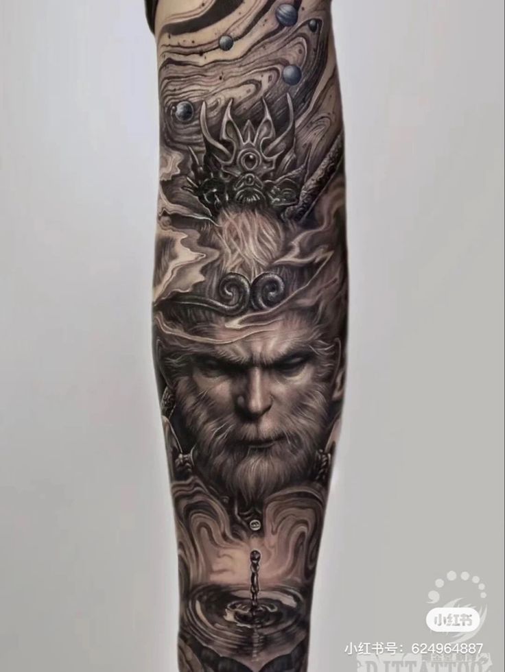 a man's leg with tattoos on it and an image of a lion in the background