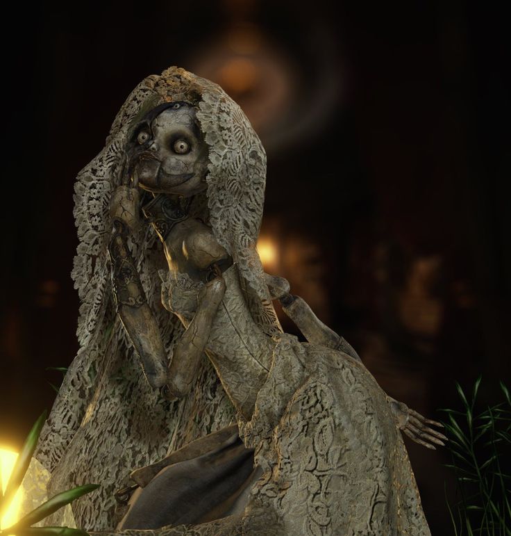 a statue of a woman with long hair and eyes