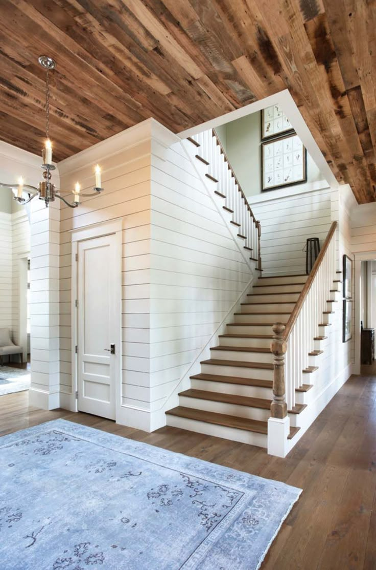 the inside of a house with stairs and hardwood floors on instagram for real estate