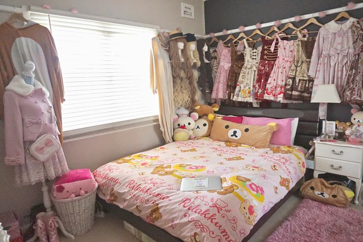 a bed room with a neatly made bed and lots of stuffed animals on the wall