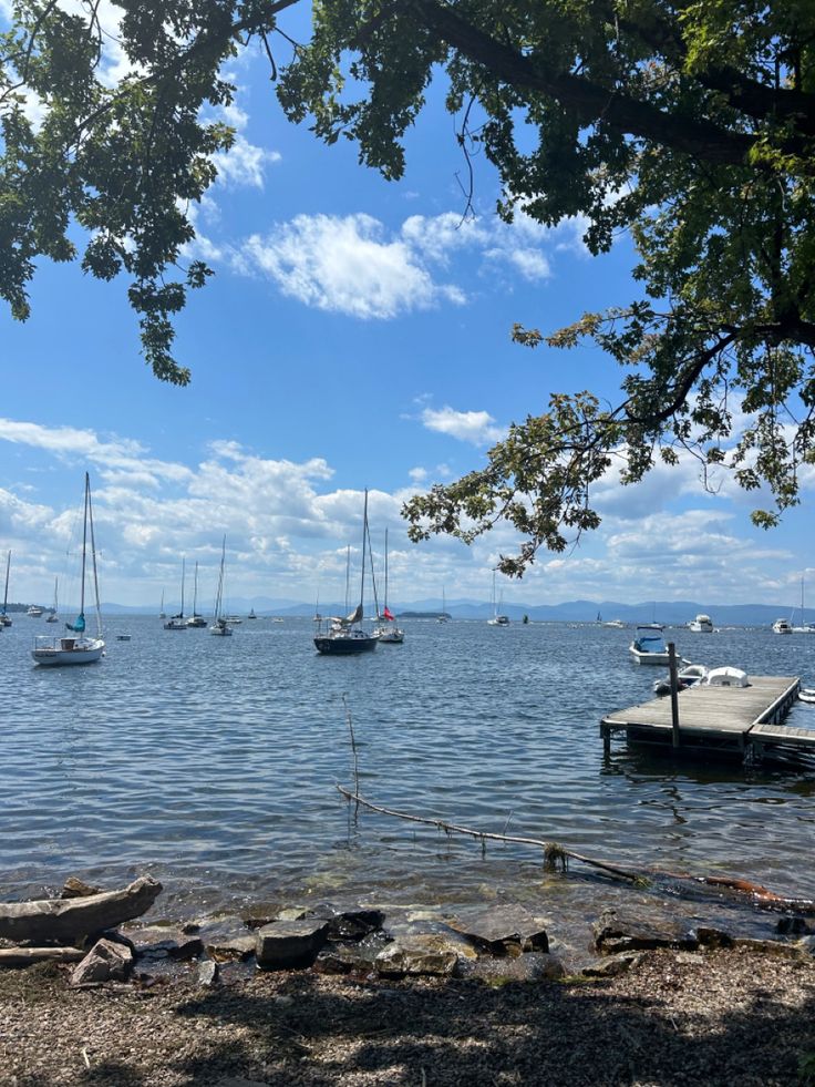 several boats floating on top of a large body of water