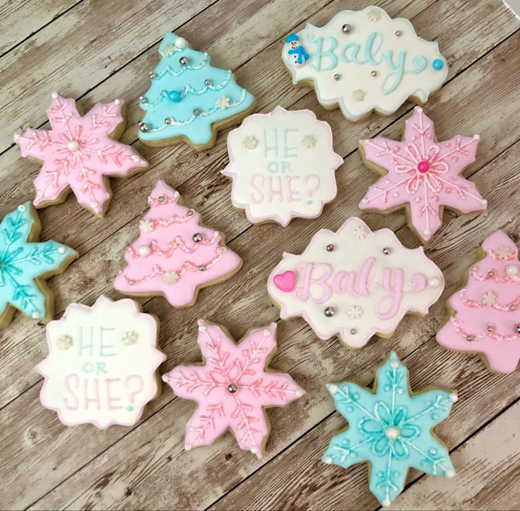 some decorated cookies are on a wooden table