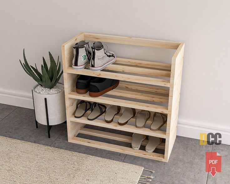 there is a shoe rack with shoes on it next to a potted plant and rug