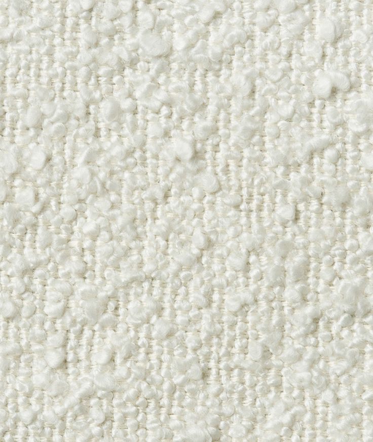 an up close shot of white fabric textured with small dots on the top and bottom