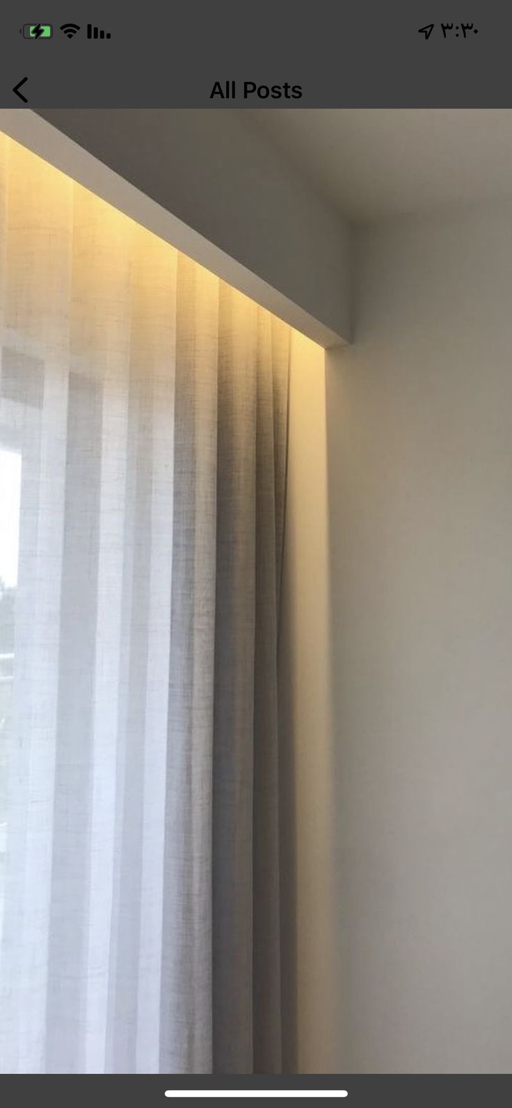 an open window with white curtains and light coming from the top right corner in front of it