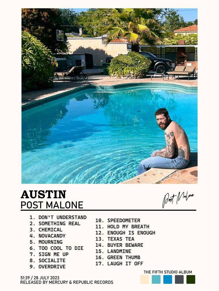 a man sitting on the edge of a swimming pool