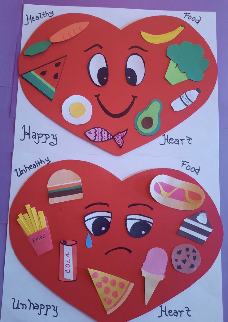 two heart shaped cut outs with different types of food on them