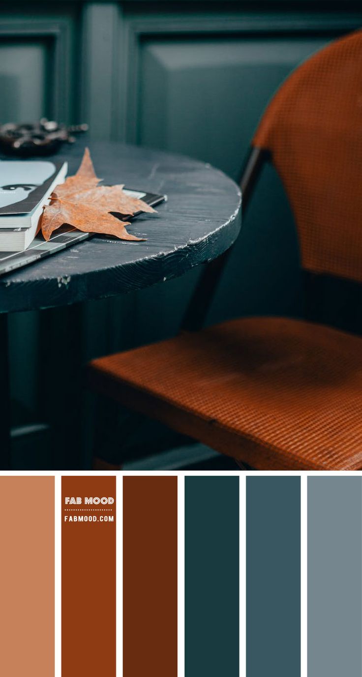 a table with some leaves on it next to a chair and color swatches in the background