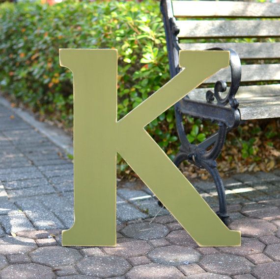 the letter k is placed next to a bench