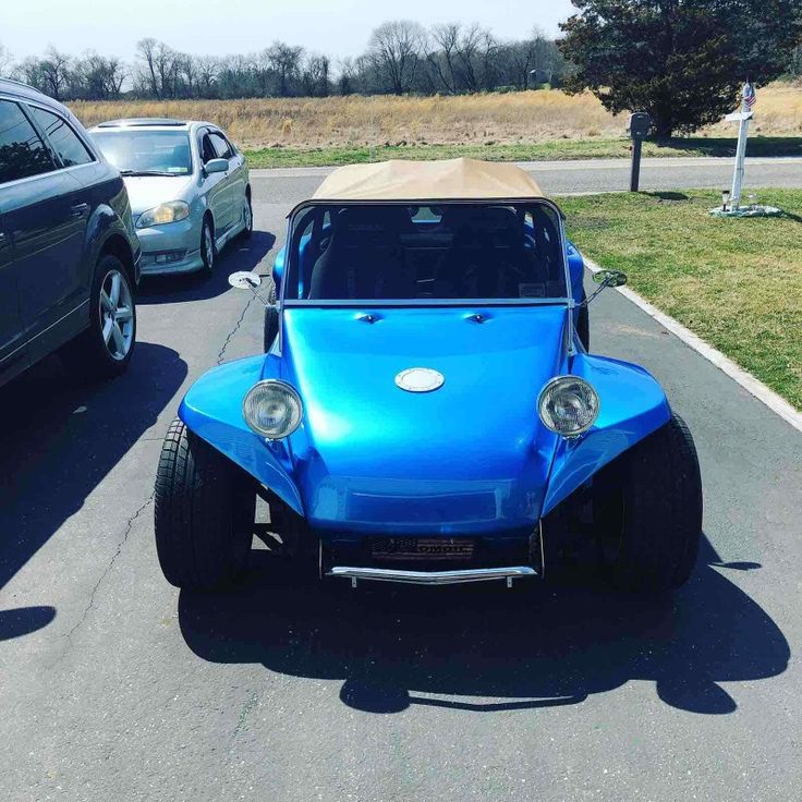 an electric buggy is parked in a parking lot