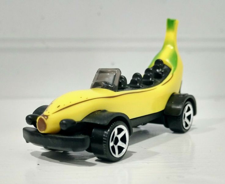 a toy car with a banana in the back