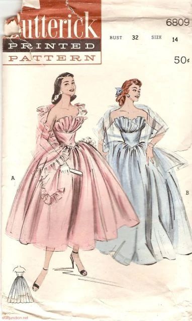 two women in dresses, one is wearing a dress