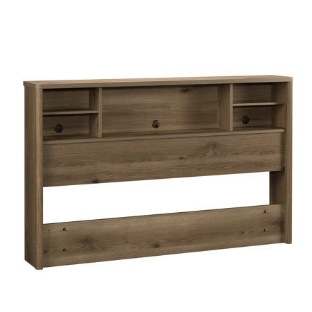 the headboard is made out of wood and has two shelves on each side, one with