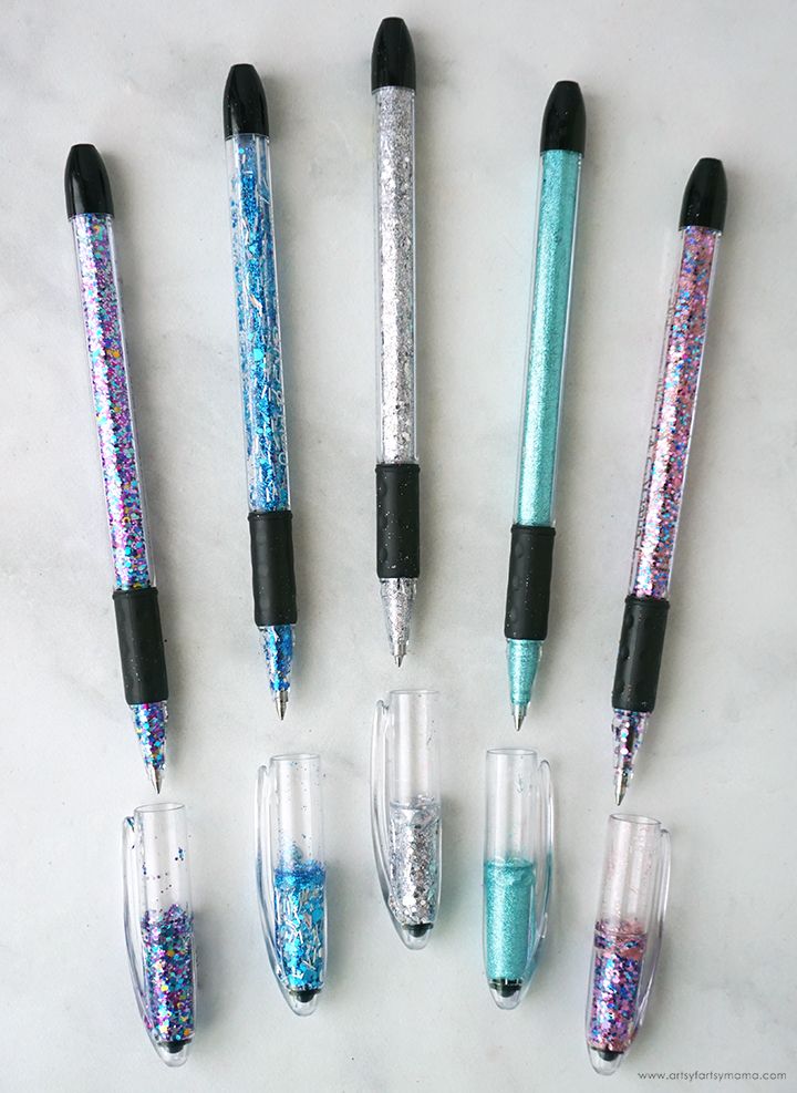 five different colored pens lined up next to each other on a white counter top with blue and pink flecks