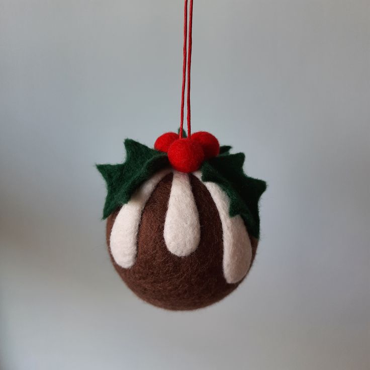 a christmas ornament hanging from a red string