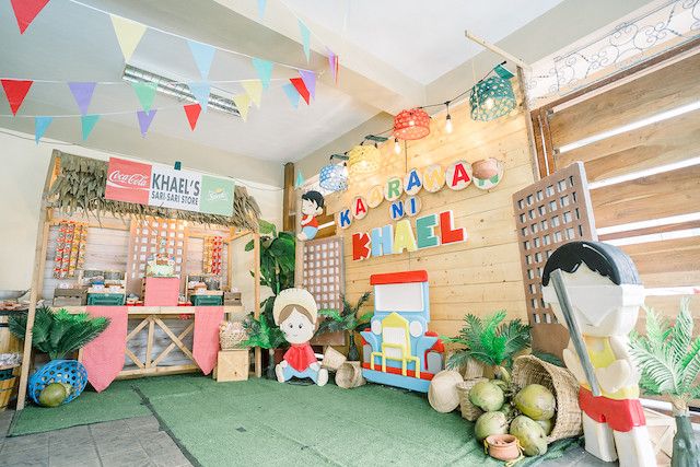 there is a small children's playroom with toys and decorations on the walls