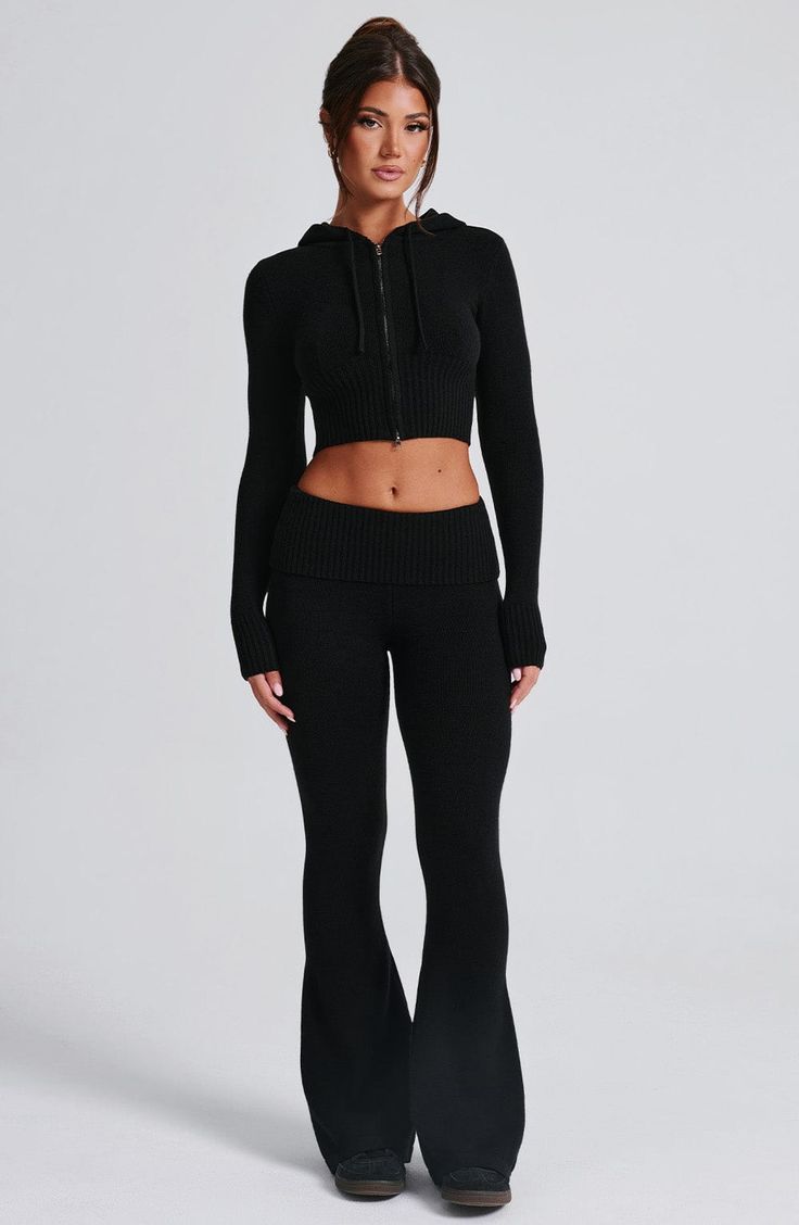 The Portia Knit Pants are a must-have for any wardrobe. These versatile pants feature a flattering fit and flare silhouette, with a wide rib waistband for added style. Complete the look with the matching Portia knit hoodie. 



Colour: Black.

Regular length.

Unlined.

Fit and flare silhouette.

Wide 2x2 rib waistband.

Fold over waistband detail.

Internal elastic in waistband.

Model is an XS and is wearing an XS.

 Size: XS, S, M, L, XL, XXL Homecoming Dresses Corset, Midi Dress Wedding Guest, Long Sleeve Homecoming Dresses, Black Flare Pants, Versatile Pants, Homecoming Dresses Long, Maxi Dress Sale, Sparkle Dress, Dresses By Length