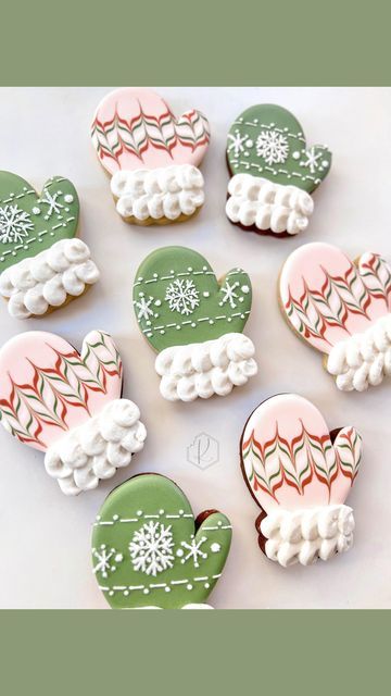 decorated cookies are arranged in the shape of santa's mittens and snowflakes