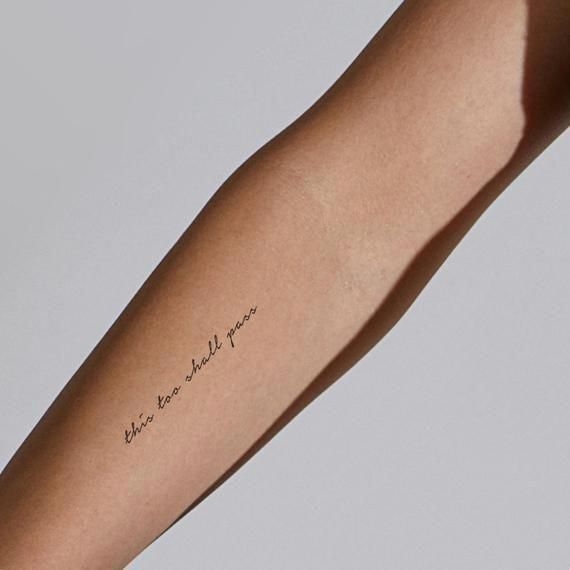 a person with a tattoo on their arm that says, be the one who you are