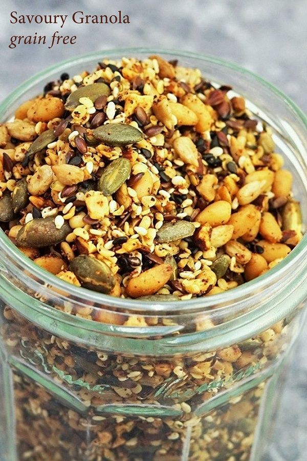 a glass jar filled with nuts and seeds