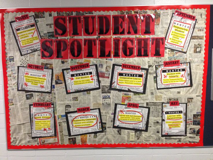 a bulletin board that has been decorated with newspaper clippings and red writing on it