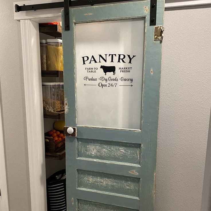 an old door is painted blue and has the pantry logo on it's side