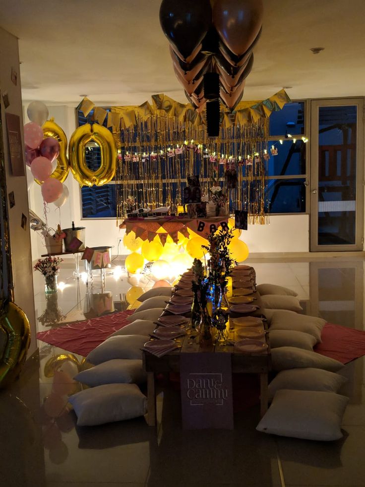 a party room with balloons and decorations