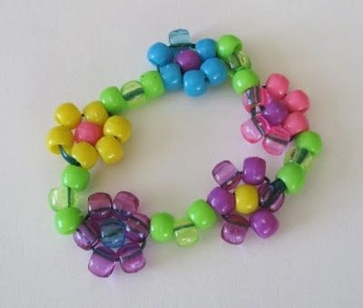 multicolored beaded flower bracelet on white background