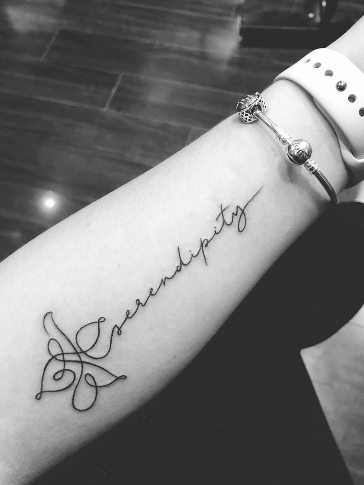 a woman's arm with a tattoo that reads, love is always in the air