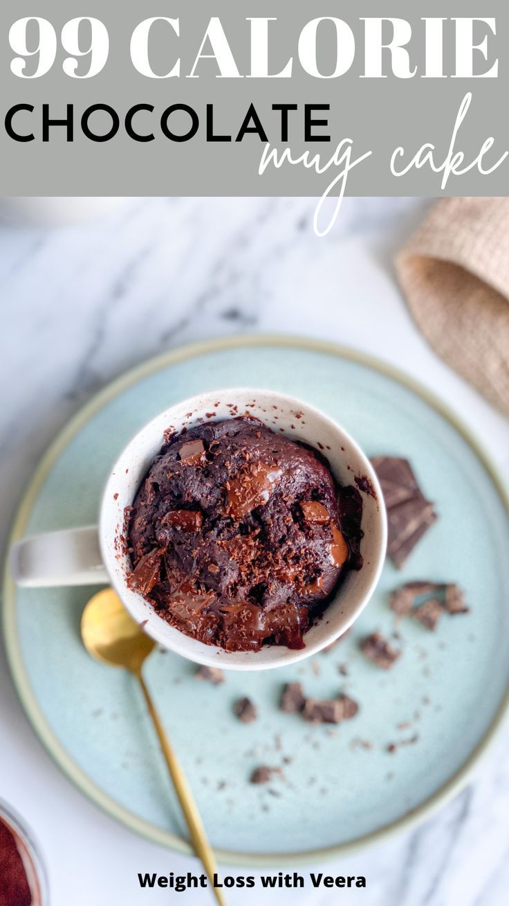 the best low calorie chocolate mug cake on a blue plate with gold spoon