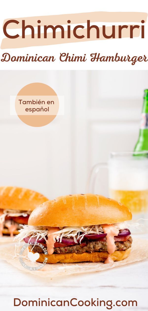 two sandwiches sitting next to each other on top of a white table with beer in the background