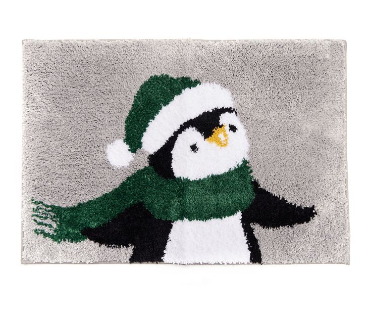 a rug with a penguin wearing a hat and scarf