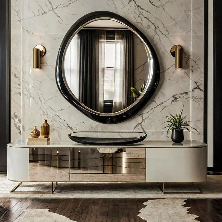 a modern console table with a round mirror above it