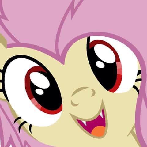 a close up of a pink pony with big eyes