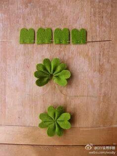 four leaf clovers are arranged on a table