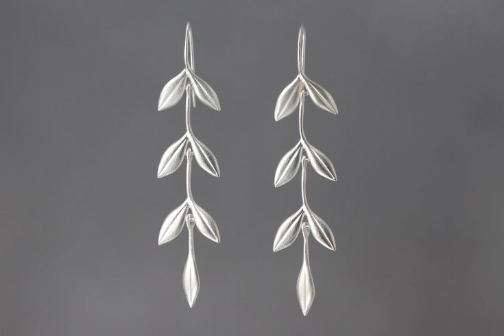 Silver Earrings - Cascading double-leaf links with single leaf drop, forming lovely dangles that are easy to wear.<br><br>2.88l, 0.5w. Sterling silver ear wires. Simple Silver Earrings Dangle, Silver Leaf Jewelry, Leaf Drop Earrings, Silver Leaf Minimalist Earrings, Silver Leaf-shaped Nature-inspired Jewelry, Elegant Leaf-shaped Sterling Silver Earrings, Silver Leaf-shaped Metal Earrings, Sterling Silver Leaf-shaped Earrings, Leaf Necklace Silver