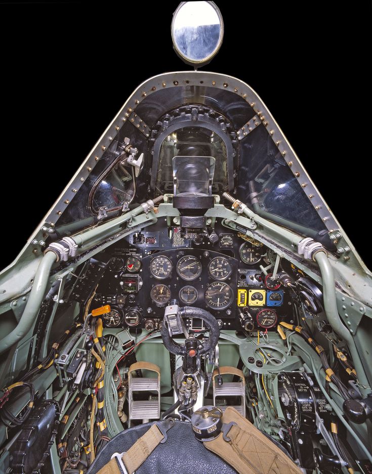 the cockpit of an airplane with many instruments