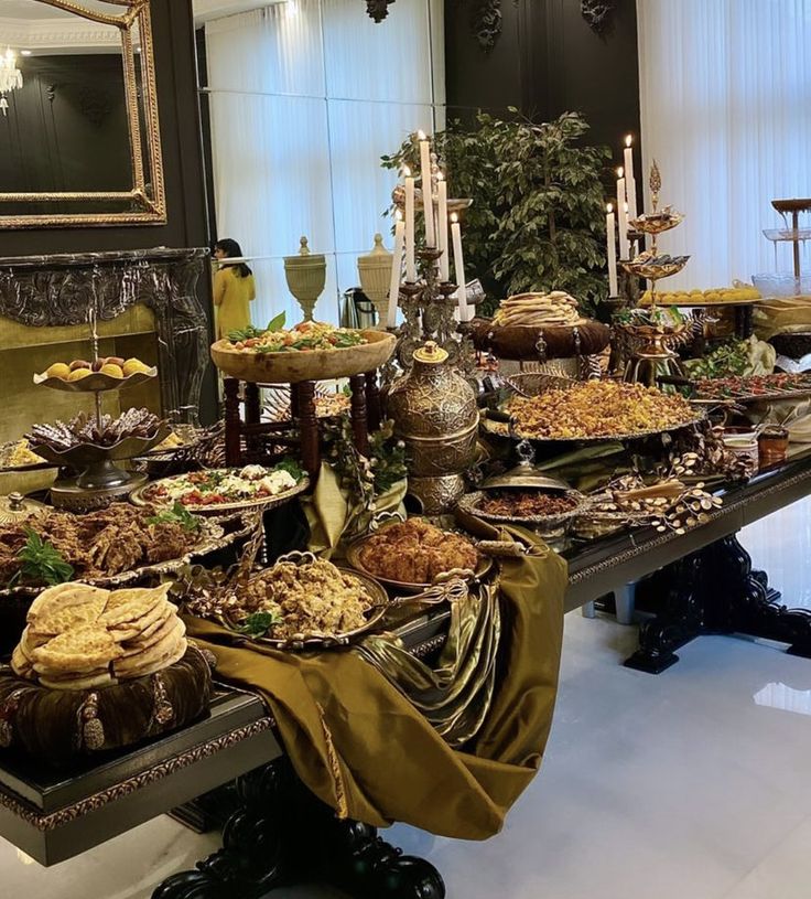 a buffet table filled with lots of food