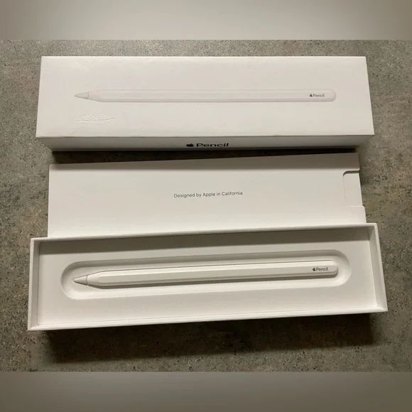 an apple macbook pro with its box opened on the floor next to it's packaging