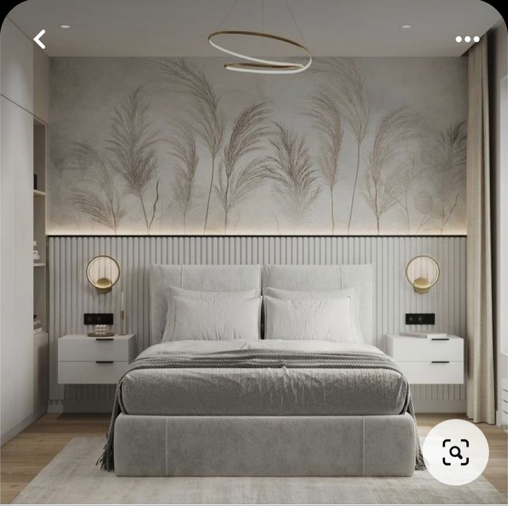 a bedroom with a bed, nightstands and paintings on the wall behind it in shades of gray