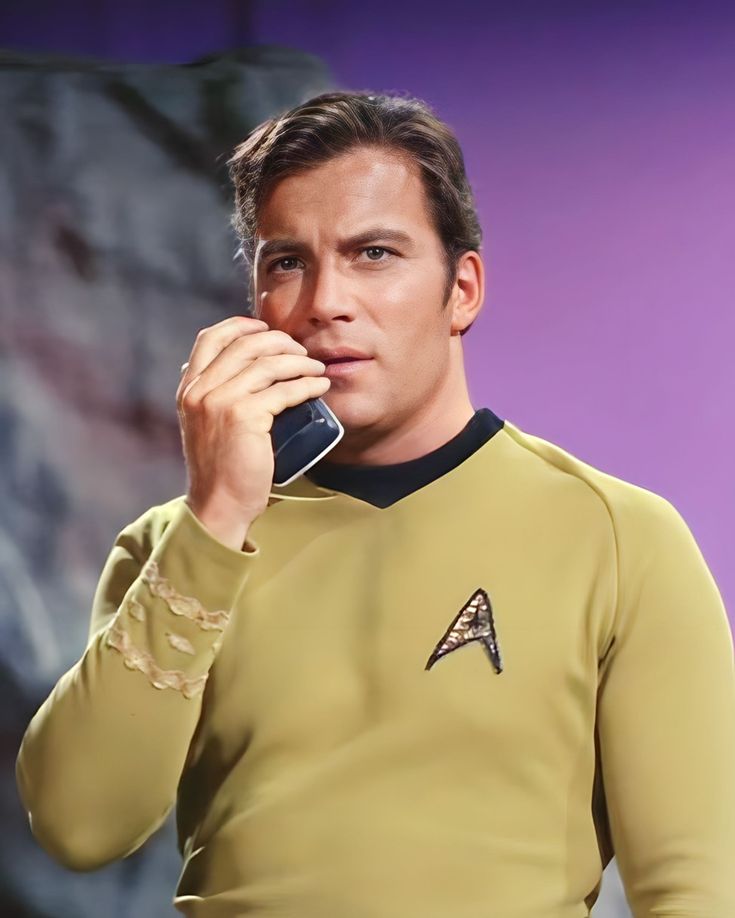 a man in a star trek uniform talking on a cell phone