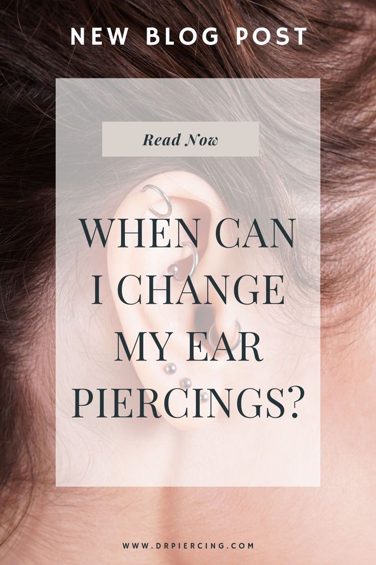 a woman's ear with the words, when can i change my ear piercings?