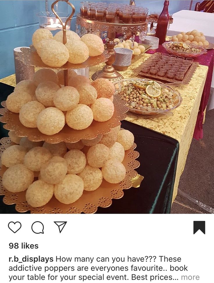 a table topped with lots of desserts and cookies on top of it's sides