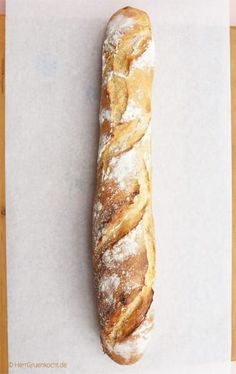 a loaf of bread sitting on top of a cutting board