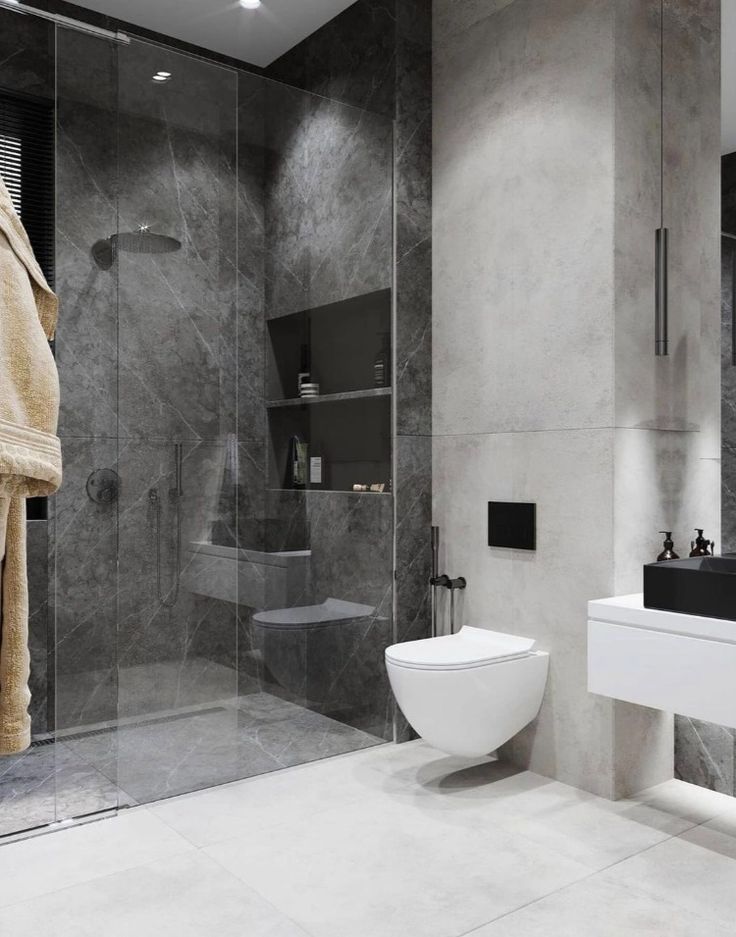 a modern bathroom with marble walls and flooring