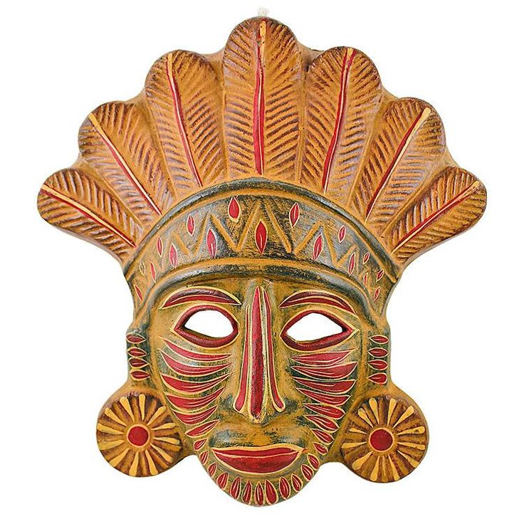 an ornate mask with red and green designs on it's face, against a white background